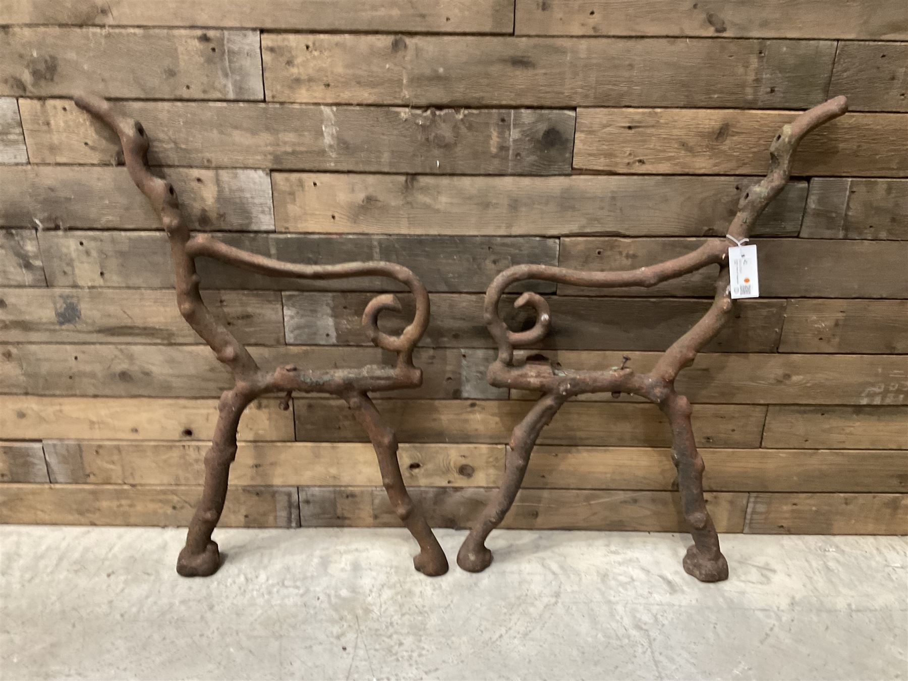 Pair of faux bois cast metal bench ends; together with wooden slatted bench with metal ends