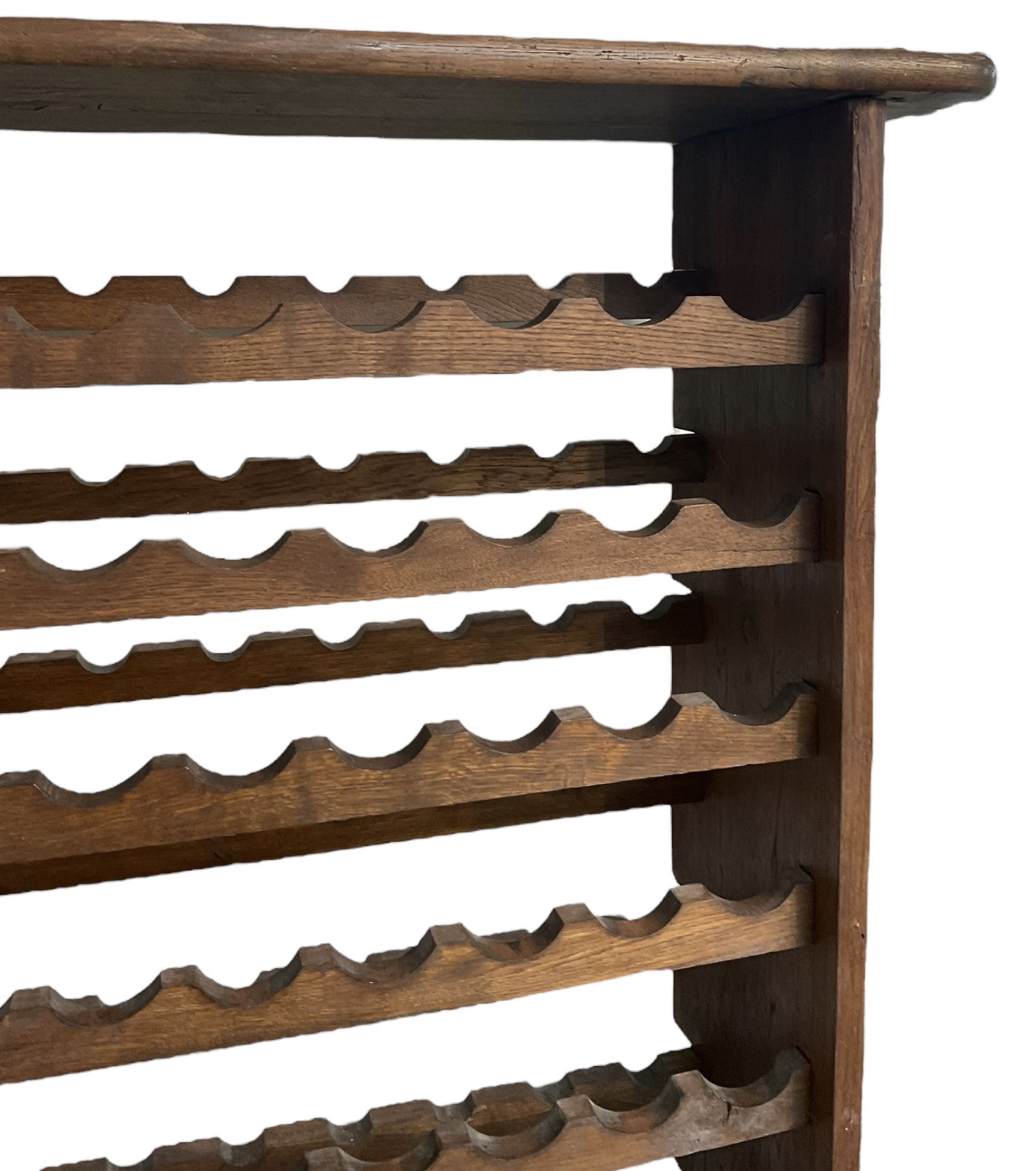 Large reclaimed oak eight tier wine rack, rectangular top over eight racks each with ten bottle divisions, on end supports