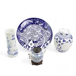 Chinese blue and white ginger jar, with sepia decoration, possibly unfinished, double ring mark beneath, H21cm, Chinese blue and white prunus pattern charger, D37.5cm, Japanese vase and a Chinese blue and white teapot, with associated cover and stand (4)