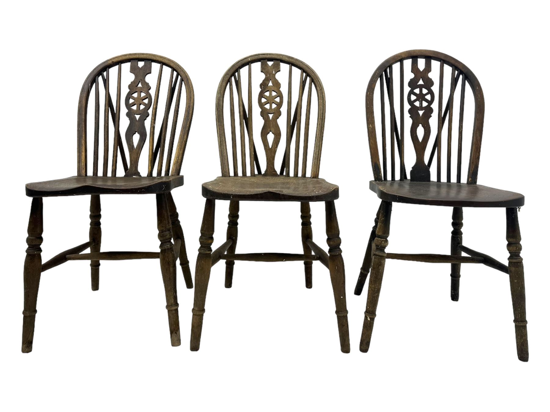 Mid-to-late 20th century set of six elm and beech Windsor dining chairs, hoop and stick back with pierced wheel splat, dished elm seat, on turned supports united by turned stretchers 