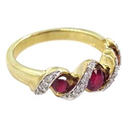 9ct gold three stone ruby and diamond crossover ring, hallmarked