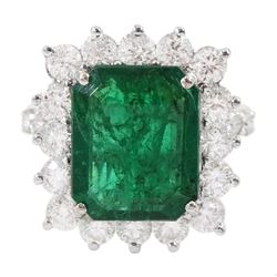 18ct white gold octagonal cut emerald and round brilliant cut diamond cluster ring, with diamond set shoulders, emerald 4.64 carat, total diamond weight 1.80 carat, with World Gemological Institute report