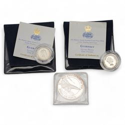 Commemorative and other coinage, including The Royal Mint United Kingdom 2000 'Queen Elizabeth The Queen Mother Centenary Year' silver proof five pounds, 2014 'SS Gairsoppa Britannia' quarter ounce silver coin in card folder, two Bailiwick of Guernsey 1997 silver proof one pound coins etc