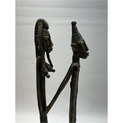 Five bronzed tribal figures, of elongated form, tallest H18cm