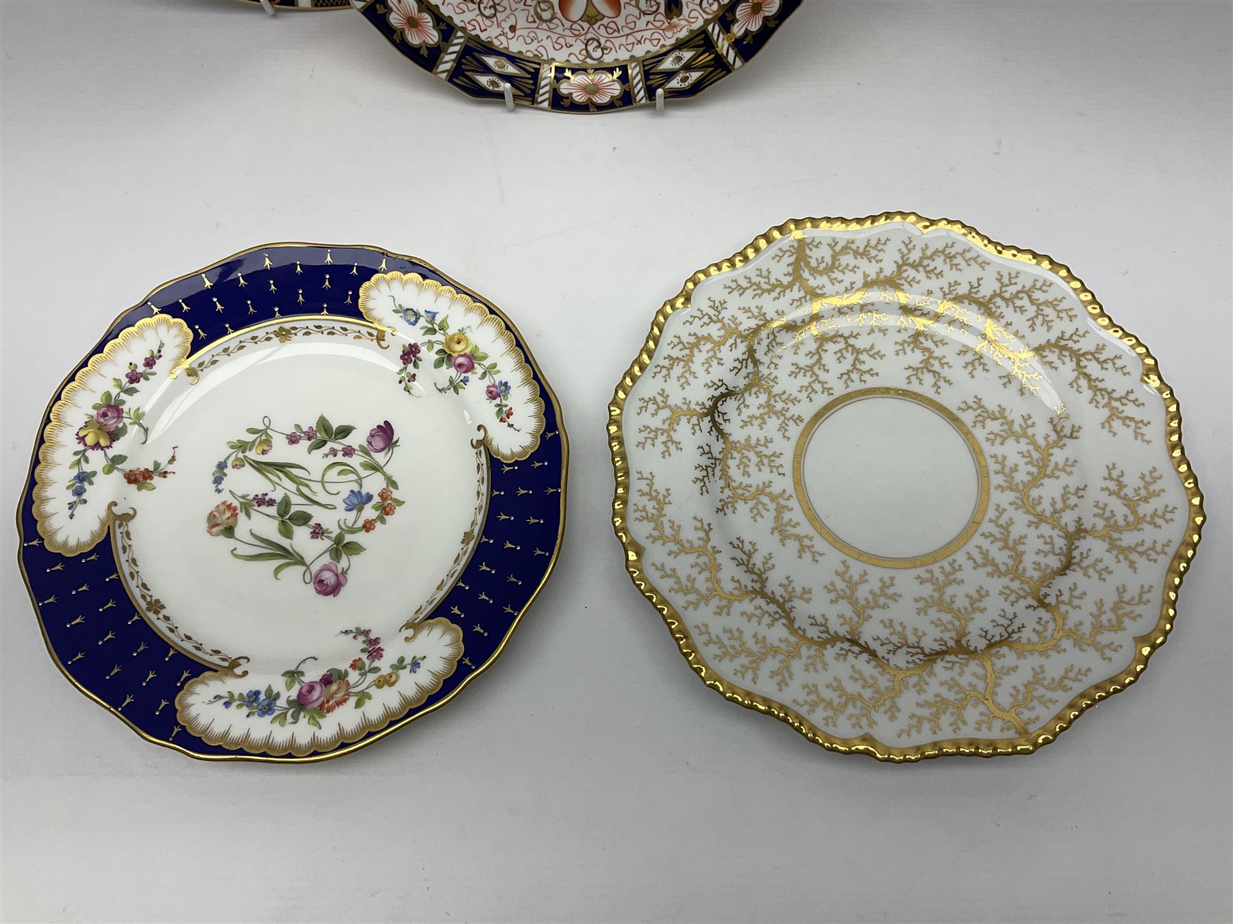 Seven cabinet plates including Royal Crown Derby Imari examples, early Worcester Flight & Barr gilded example etc