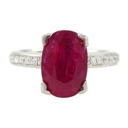 18ct white gold oval cut ruby ring, with channel set diamond shoulders, hallmarked, ruby a...