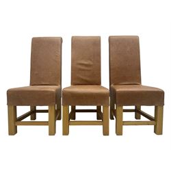 Set of six contemporary light oak dining chairs, each with high back and seat upholstered in pale tan leather, on square supports connected by H-stretcher