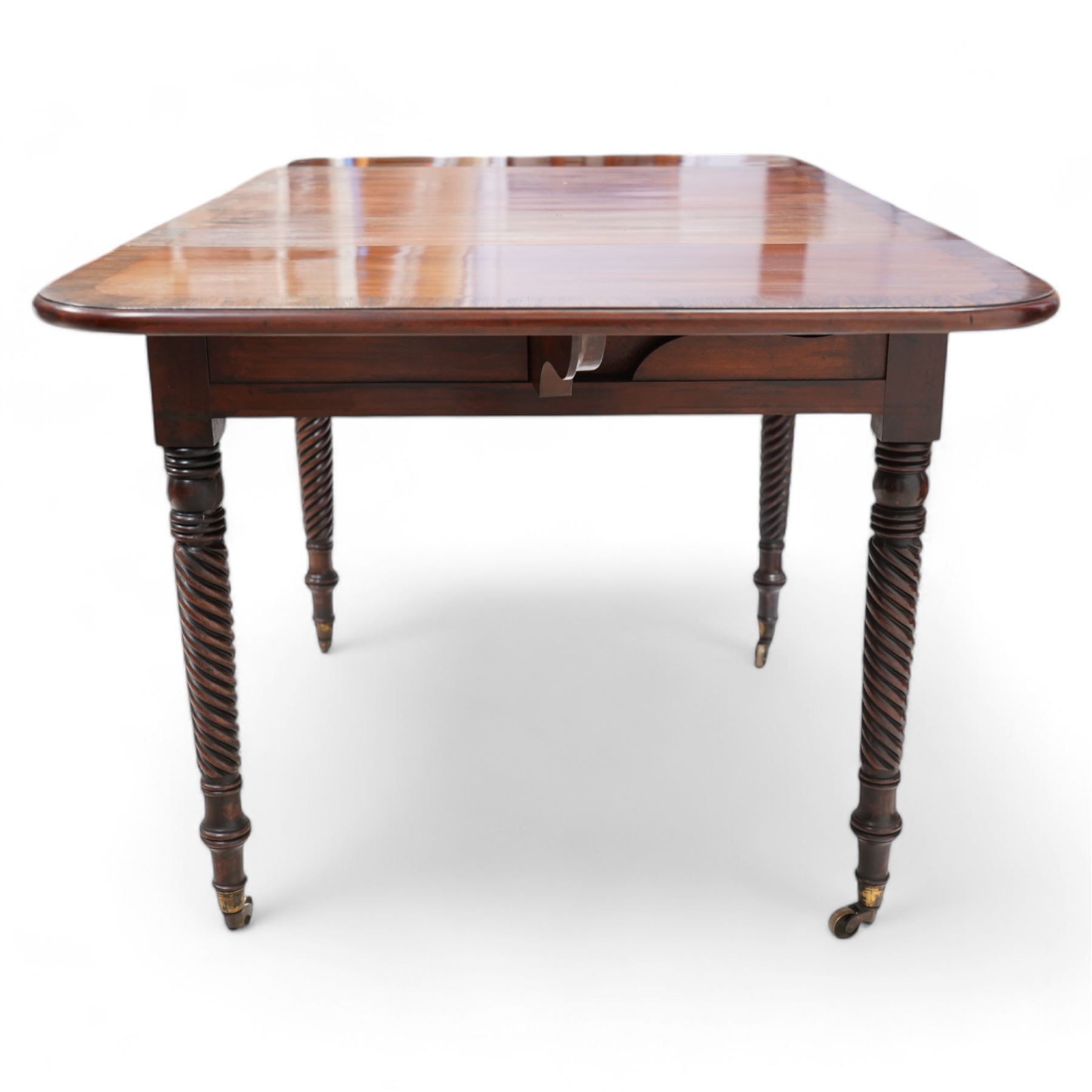 19th century mahogany centre table, moulded drop-leaf top with rounded corners and rosewood band, fitted with single cock-beaded drawers and opposing false drawer, on rope twist supports with brass cups and castors 