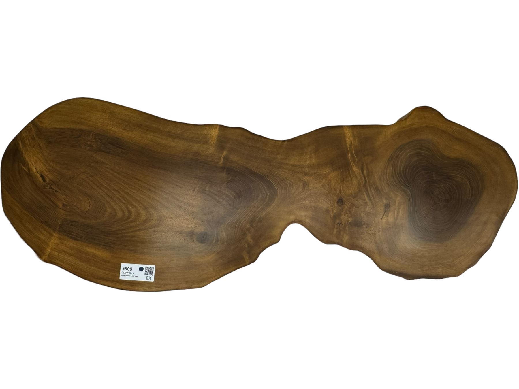 Mid-20th century live edge walnut coffee table, the top showcases the natural grain and organic form of the wood, supported by three tapered legs 