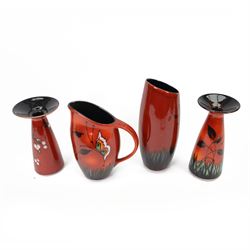 Two Poole Pottery vases decorated in Butterfly pattern, together with matching jug and ano...