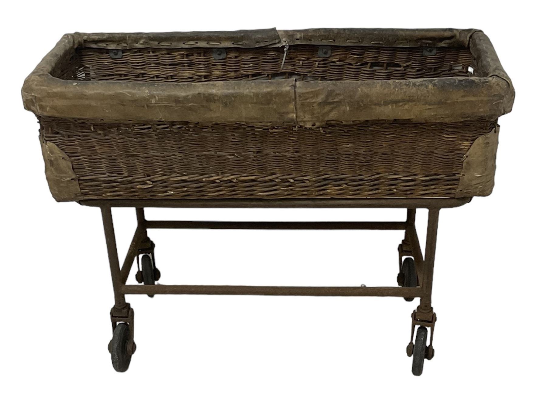 Early 20th century GPO wicker and hide bound postal trolley, on a cast iron base with castors