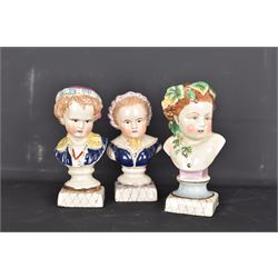 Pair or 20th century continental Bourbon children busts, together with another similar, H23cm