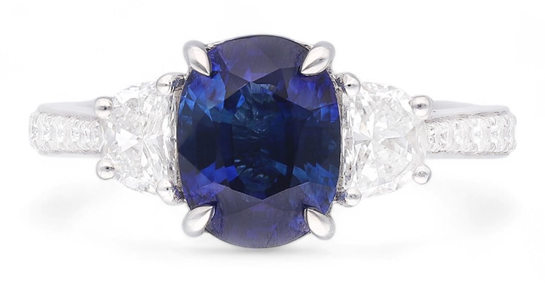 Platinum three stone oval cut sapphire and half moon cut diamond ring, with diamond set shoulders, hallmarked, sapphire 2.73 carat, total diamond weight approx 1.10 carat