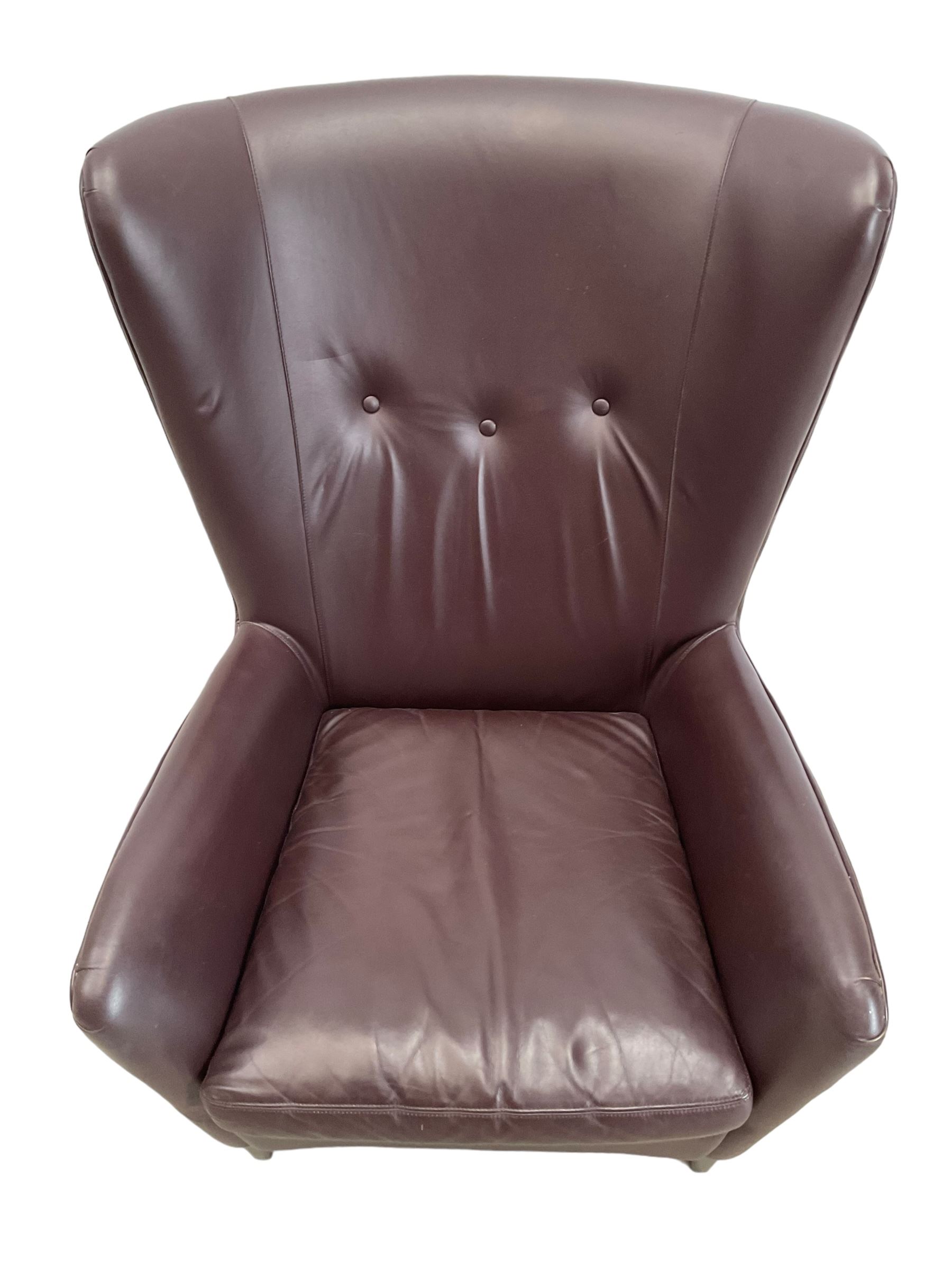 Wing back armchair upholstered in cocoa brown leather