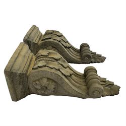 Pair of Victorian design cast stone architectural corbel wall brackets, stepped rectangular top over a scrolled bracket with relief acanthus leaf decoration and rosette motifs to the side