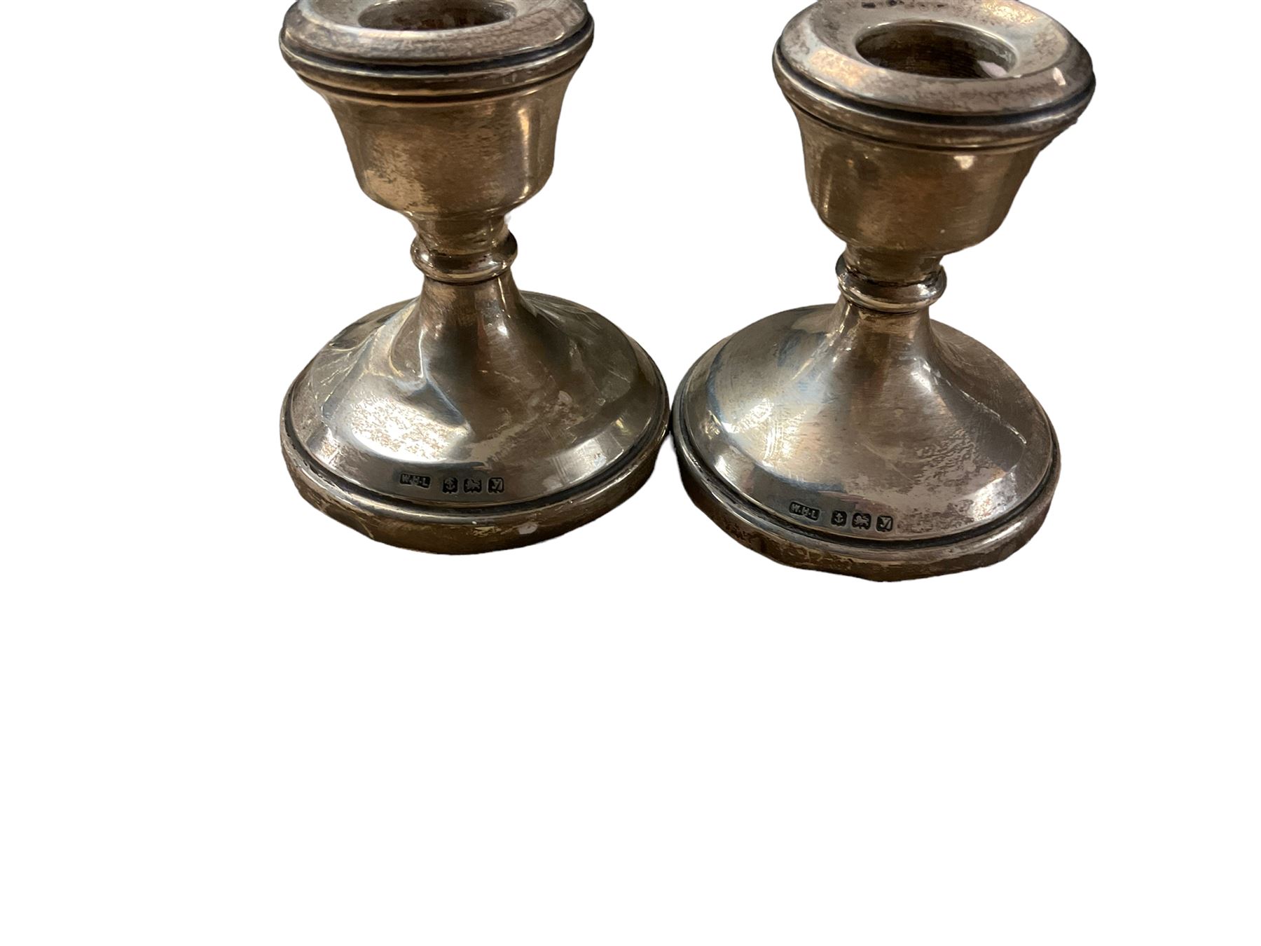 Silver candlesticks, hallmarked, together with silver brush and scent bottles with silver collars and other items  