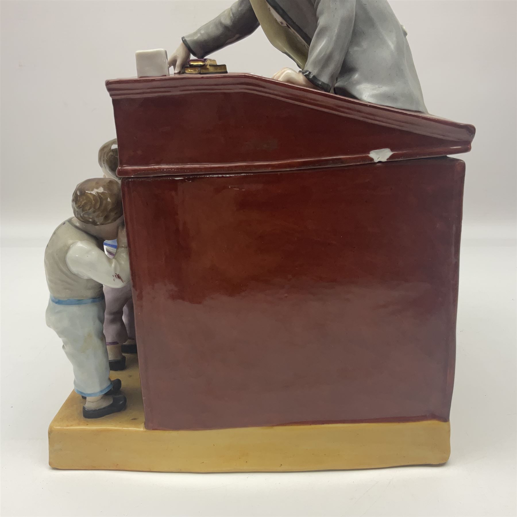 19th century Continental jar and cover, modelled as a classroom, with the teachers desk as the cover, H27cm