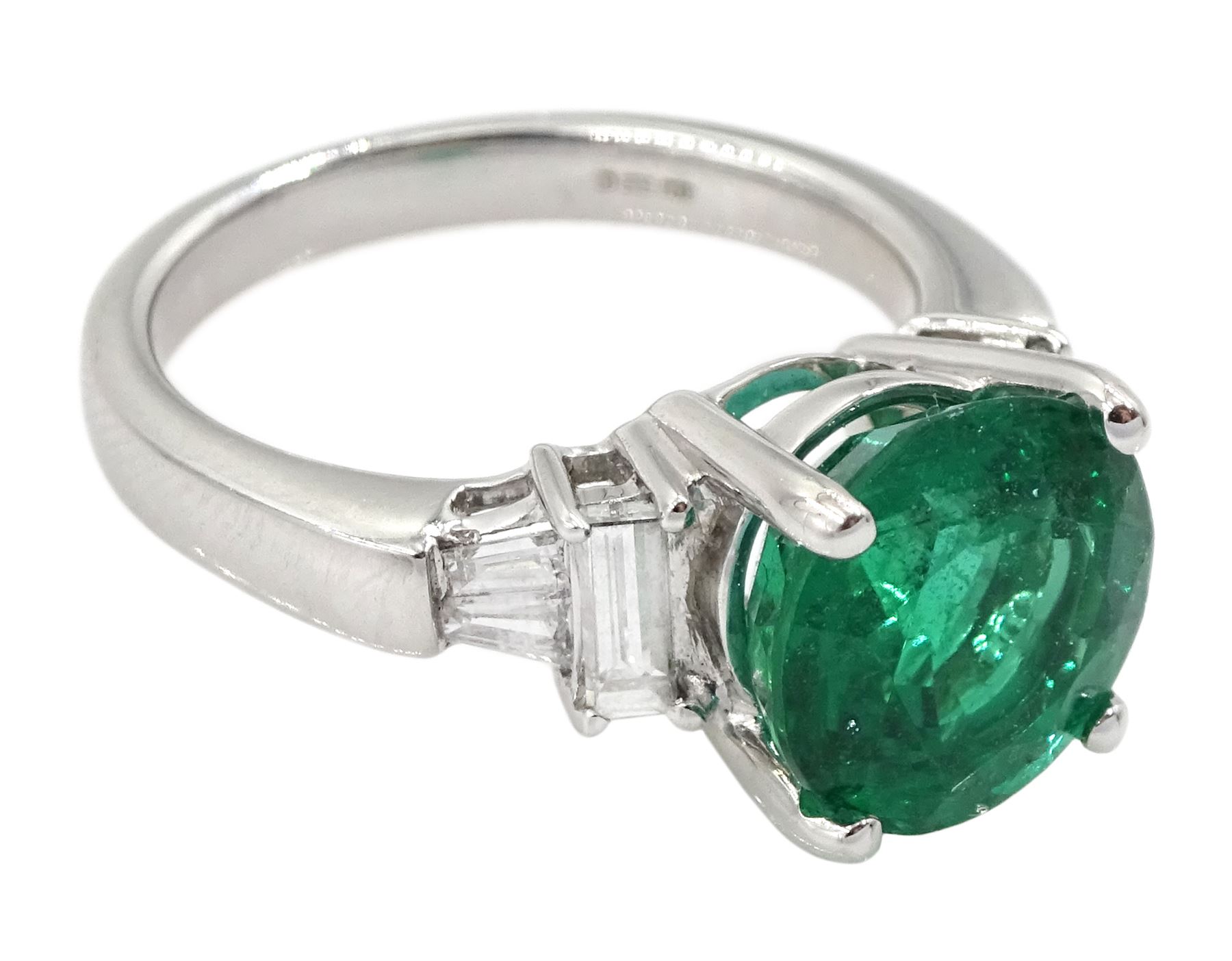 18ct white gold three stone round emerald, baguette and tapered baguette cut diamond ring, hallmarked, emerald approx 3.10 carat