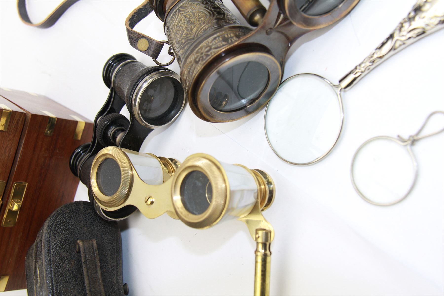 Pair of brass and mother of pearl opera glasses, together with a gilt metal pair of racing binoculars and one other pair, etc 