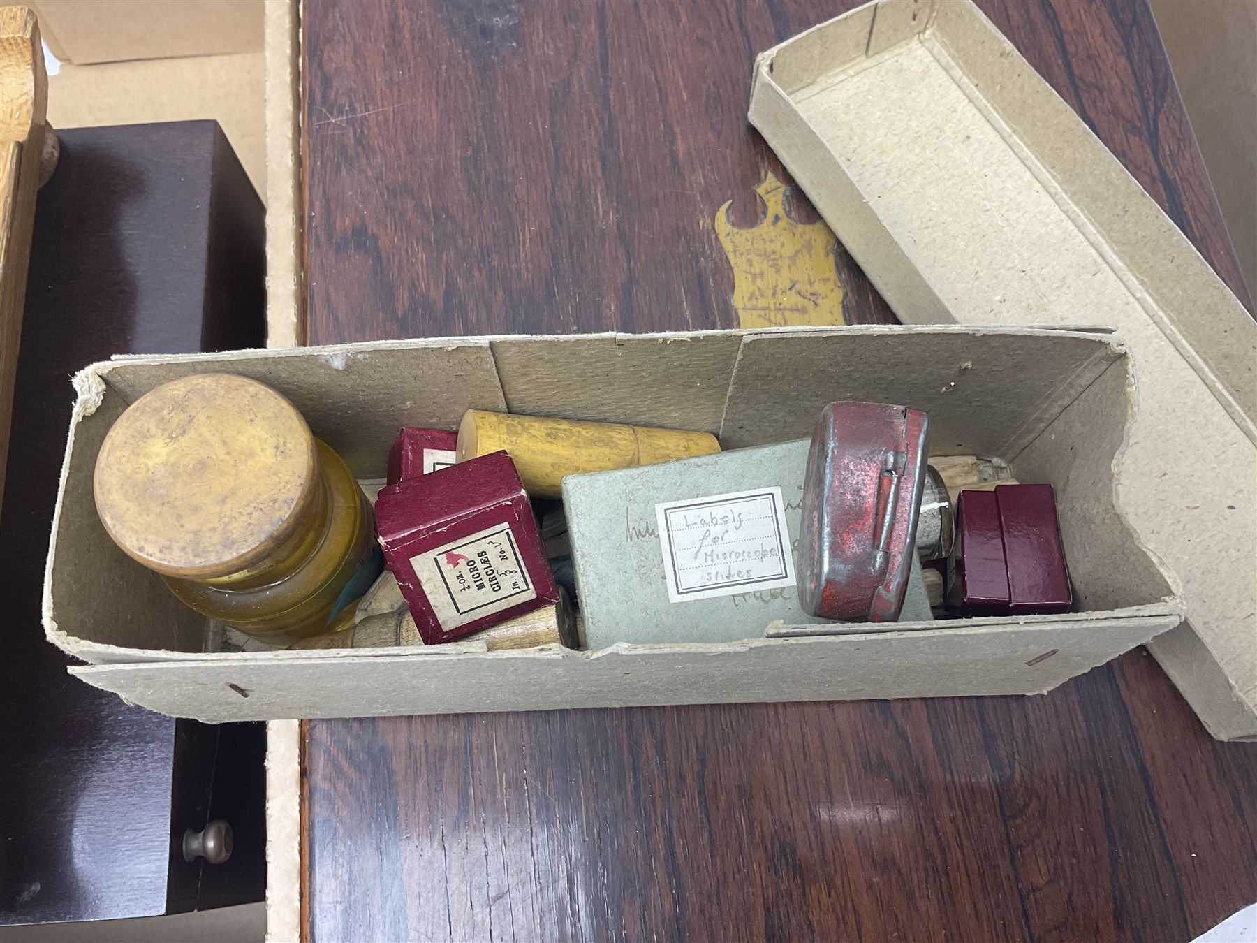 Hexagonal inkwell, in a wooden base, together with two writing slopens etc