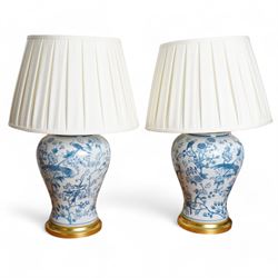 Pair of large table lamps of baluster form, decorated with exotic birds perched in floweri...