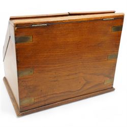 Edwardian oak correspondence box, the hinged sloping front enclosing a fitted interior incorporating a stationery rack, perpetual calendar, pen tray and two glass inkwells, H32cm x W40cm