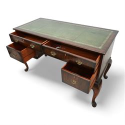 Early 20th century kneehole desk, moulded rectangular top with green leather inset, fitted with four drawers, on cabriole supports