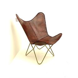 Leather sling chair over metal frame