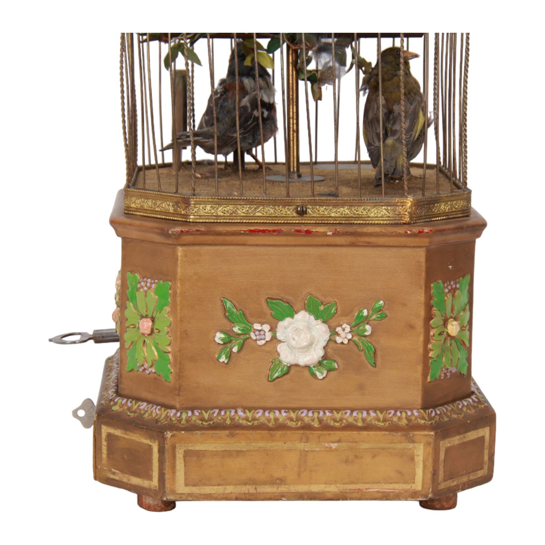 Late 19th century coin operated trio of singing birds in cage automaton, probably by J Phalibois, French, the three taxidermy birds with moving heads, beaks and tail feathers synchronized to the birdsong, under a gilt brass cage with one penny coin entry shoot, The gilt canted rectangular base with barbola decoration, H58cm