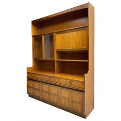 Nathan - teak wall unit, fitted with raised display cabinet and fall front compartment, three drawers and three cupboards below