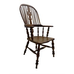 Elm and beech high back Windsor chair,  high hoop back with pierced splat and spindle supports over shaped saddle seat, raised on ring turned supports united by H-stretcher