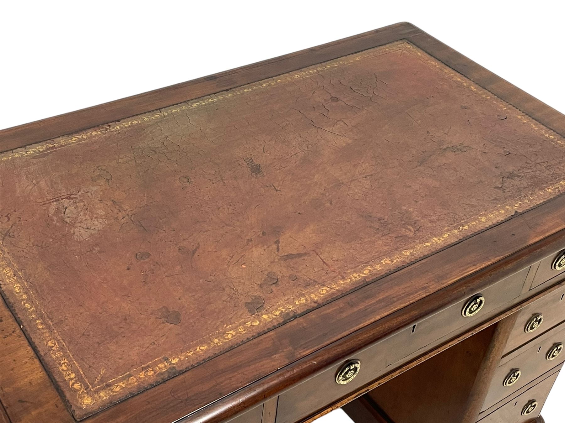 Victorian mahogany twin pedestal desk, moulded rectangular top with rounded corners and inset leather writing surface, fitted with nine drawers, on moulded plinth base