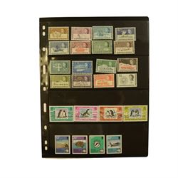 Queen Elizabeth II British Antarctic Territory mint stamps, including 1963-1969 SG 1 to 15a from half penny to both one pound values, 1993 SG 218-229 etc and a small number of Australian Antarctic Territory stamps, housed on stock pages