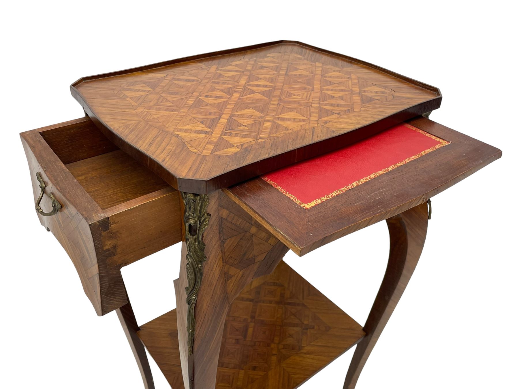 Late 20th century French design Kingwood lamp table, shaped form with geometric parquetry inlaid top within band and raised lip, fitted with single drawer and slide, on cabriole supports united by undertier, decorated with ornate cast gilt metal mounts and terminal caps 