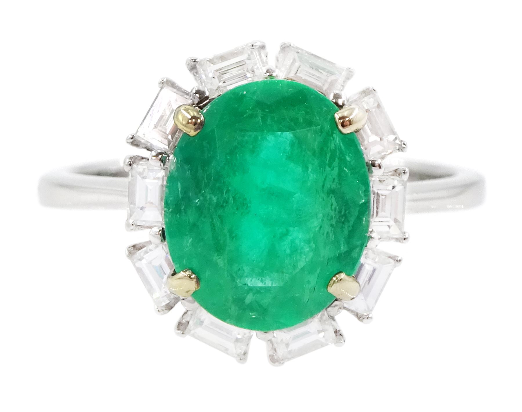 18ct white gold oval cut emerald and baguette cut diamond cluster ring, stamped 750, emerald approx 2.05 carat, total diamond weight approx 0.40 carat