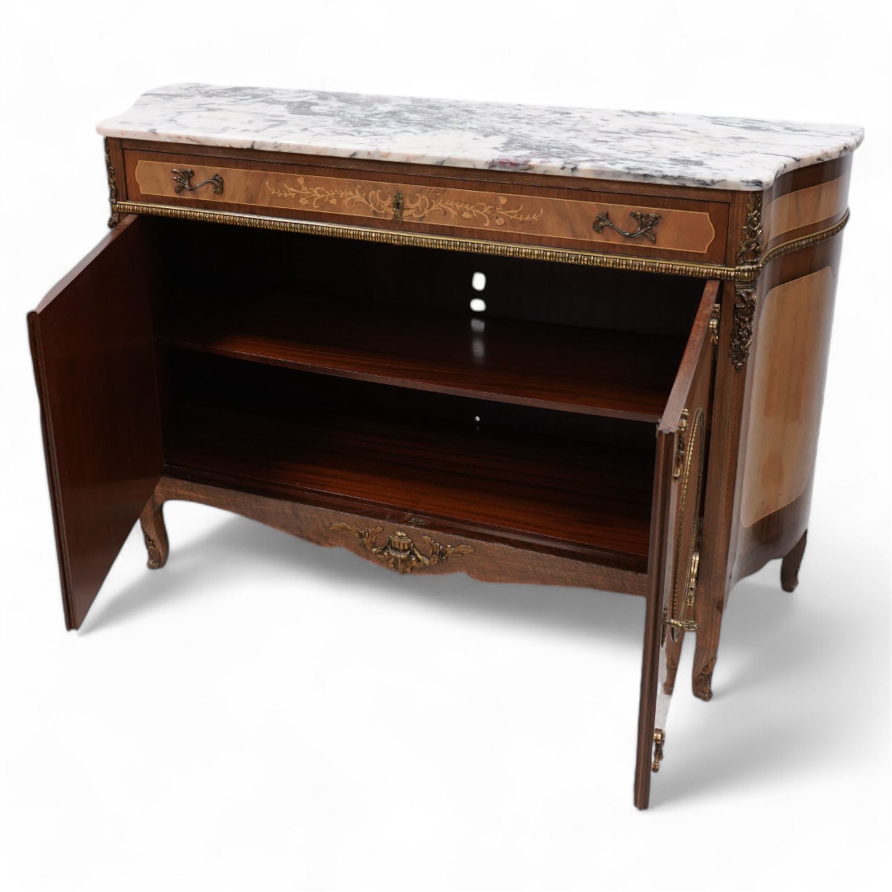 Mid-to-late 20th century mahogany and walnut side cabinet, shaped white and grey variegated marble top, single frieze drawer inlaid with scrolling leafy branches and flower heads, single internal shelf enclosed by two doors inlaid with flowers, decorated with cast gilt metal mounts, on cabriole feet 