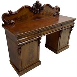 Victorian mahogany twin pedestal chiffonier, raised back with decorated with scrolling foliate motifs, fitted with three cushion drawers, the arched panelled pedestals enclosing shelves and sliding trays