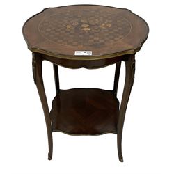 Early 20th century French two-tier marquetry inlaid walnut side table, shaped circular top with gilt metal edge, central chequered inlaid circular panel with floral motif, raised on cabriole supports with gilt metal mounts, united  by undertier