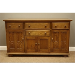  Ercol golden dawn finish sideboard with four drawers and four cupboards, W155cm, H89cm, D52cm  