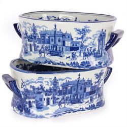 Pair of Victorian style blue and white footbaths, each with twin lug handles and transfer print decorated with city scape, H14cm