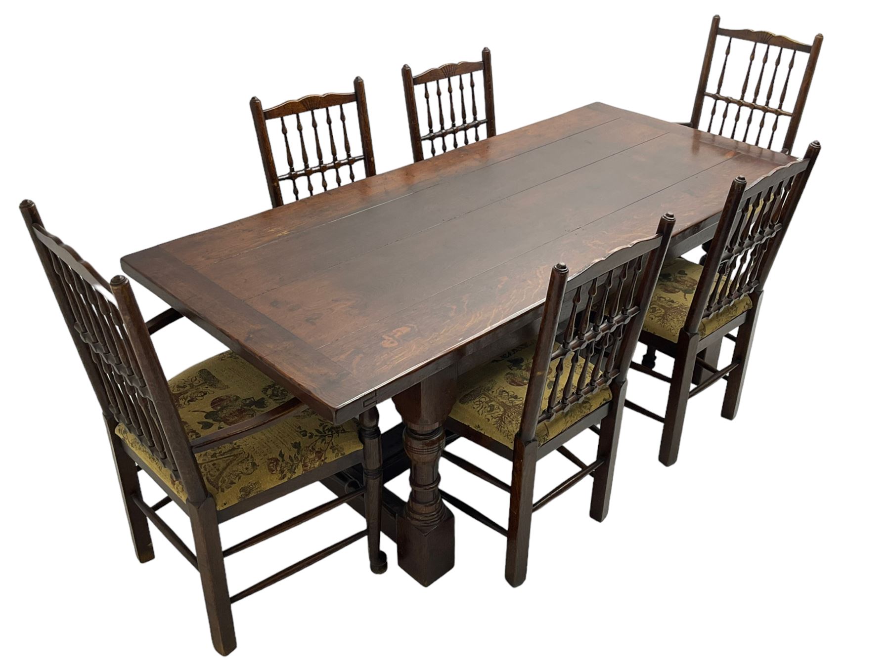 Oak refectory dining table, rectangular cleated top on turned supports joined by H-stretcher; together with set of six (4+2) oak spindle back dining chairs, with upholstered drop-on seat cushions, turned supports joined by turned stretchers