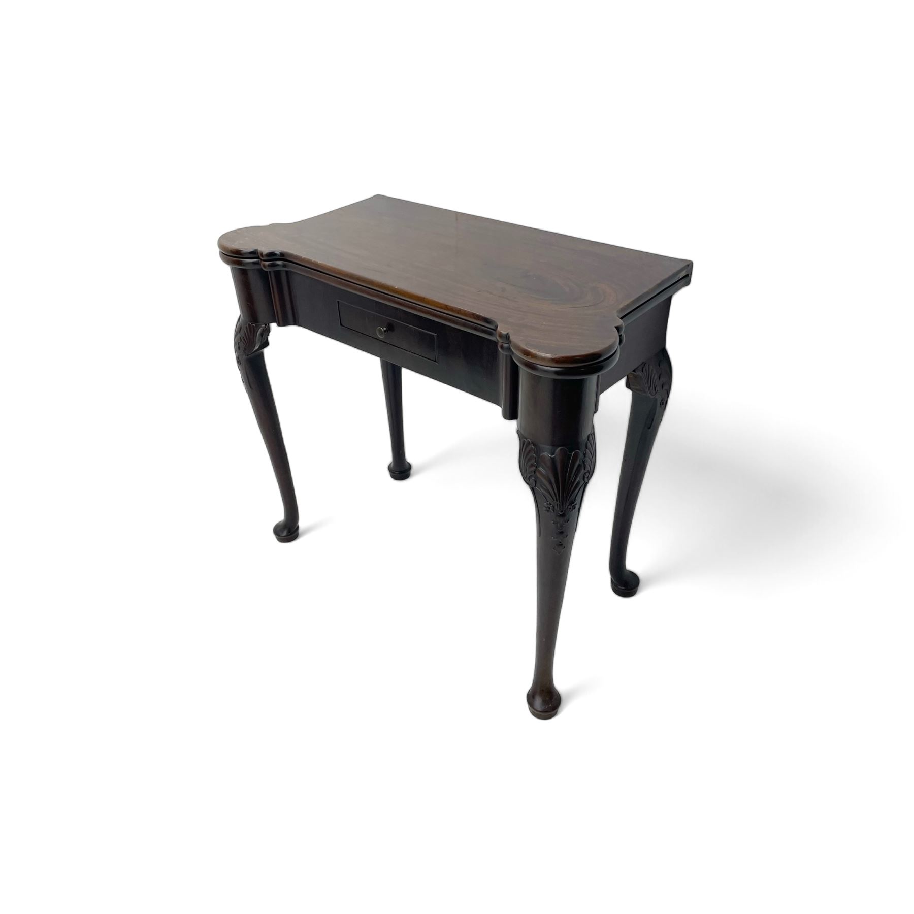 Late 18th century Irish mahogany tea table, rectangular form with projecting stepped rounded corners, fold-over action top over single frieze drawer within cock-beaded surround, on shell and bellflower carved cabriole supports, single gate-leg action base 