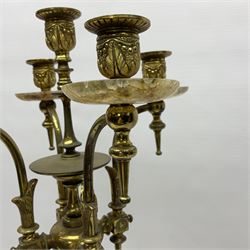 20th century five branch candelabra, with gilded floral garland and female mask decoration, to a marble effect resin urn and stepped base, upon four paw feet, H61cm