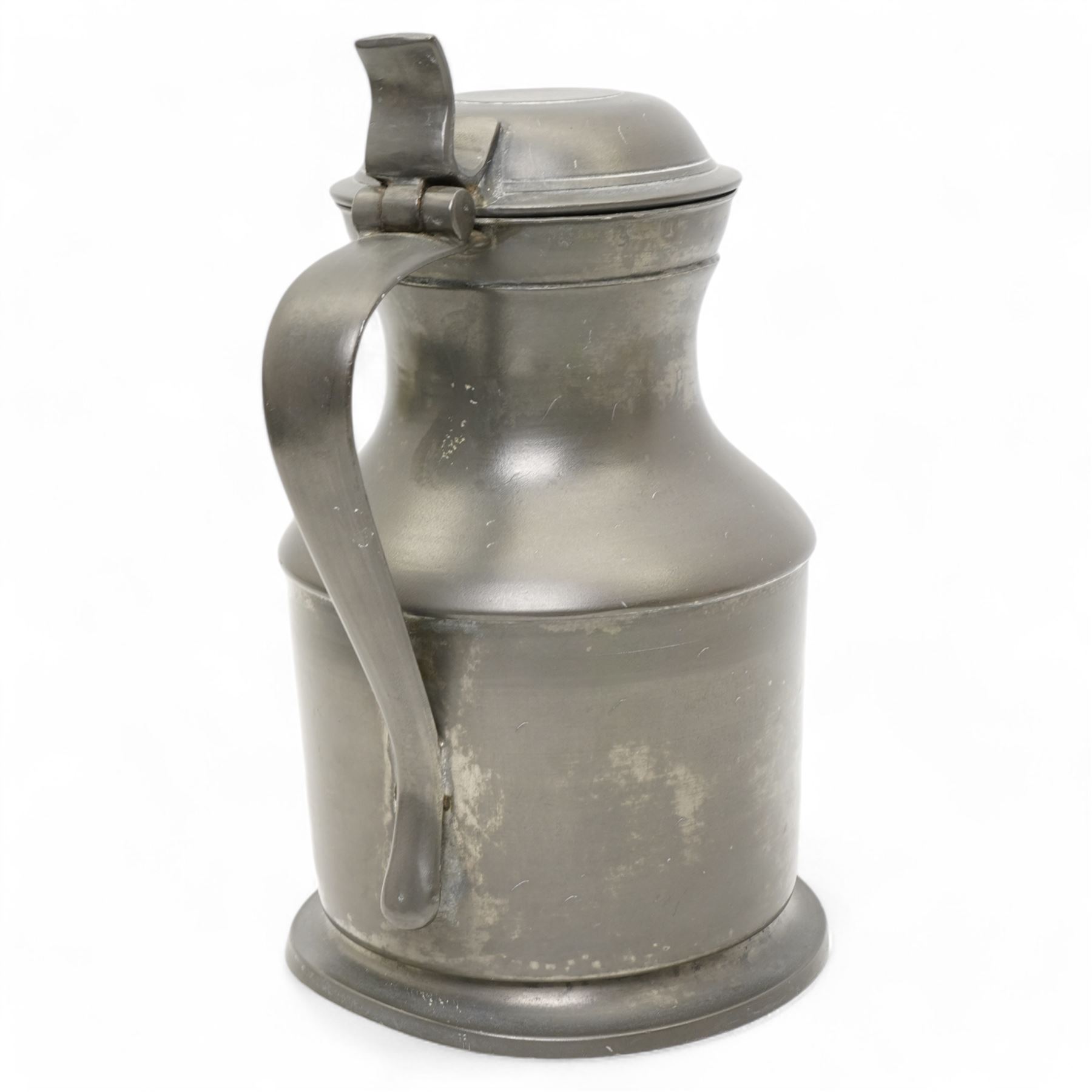 18th century pewter flagon, circa 1785, with domed tappit lid and trigger thumb piece, touch marks at the rim and base, H22cm