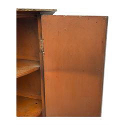 George III mahogany bow-front corner cupboard, enclosed by two figured doors with brass hinges and escutcheon, the painted interior fitted with three shelves 