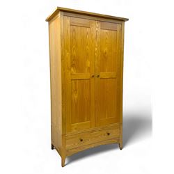 Contemporary light oak double wardrobe, projecting cornice over two panelled doors enclosi...