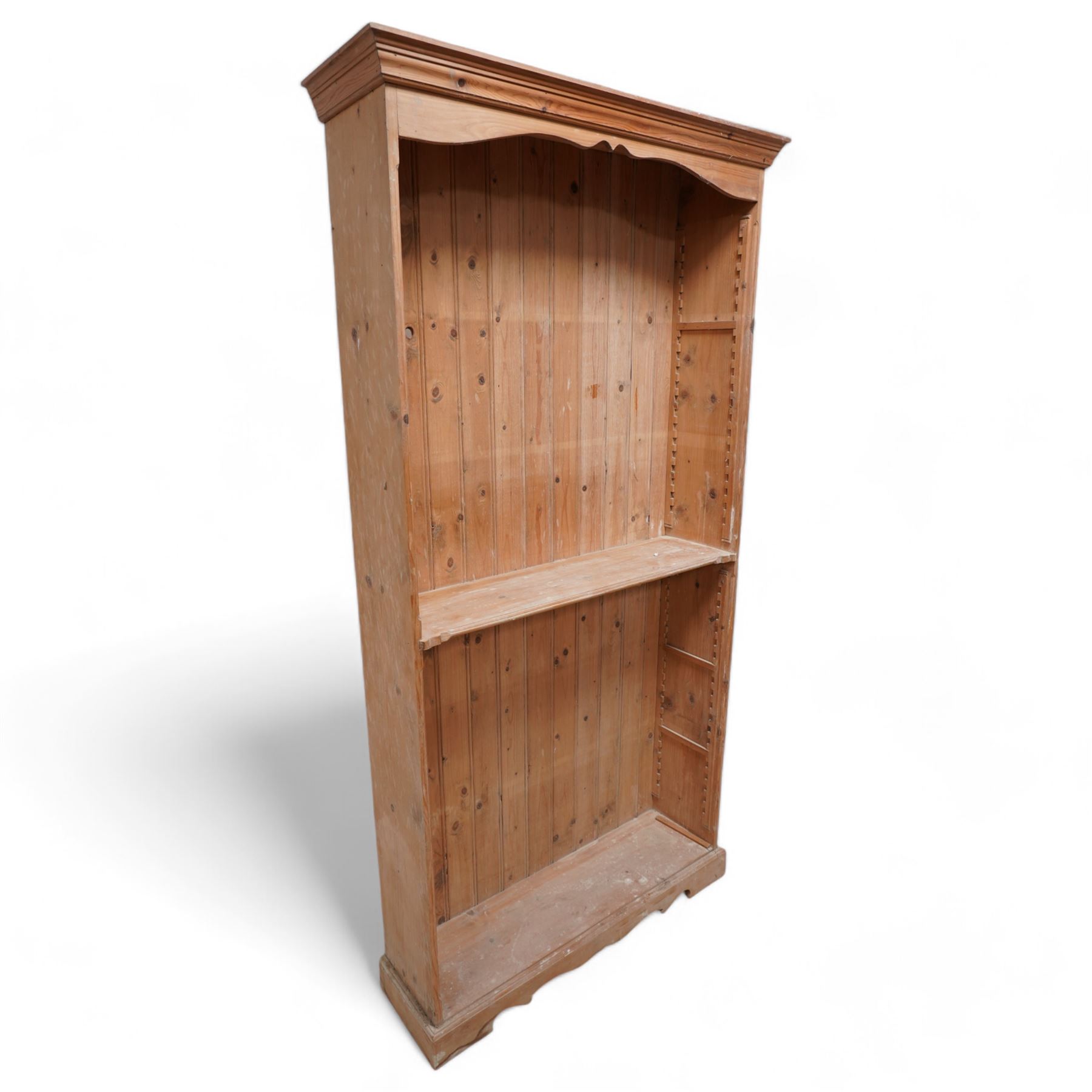 20th century rustic pine tall open bookcase, projecting cornice over shaped frieze