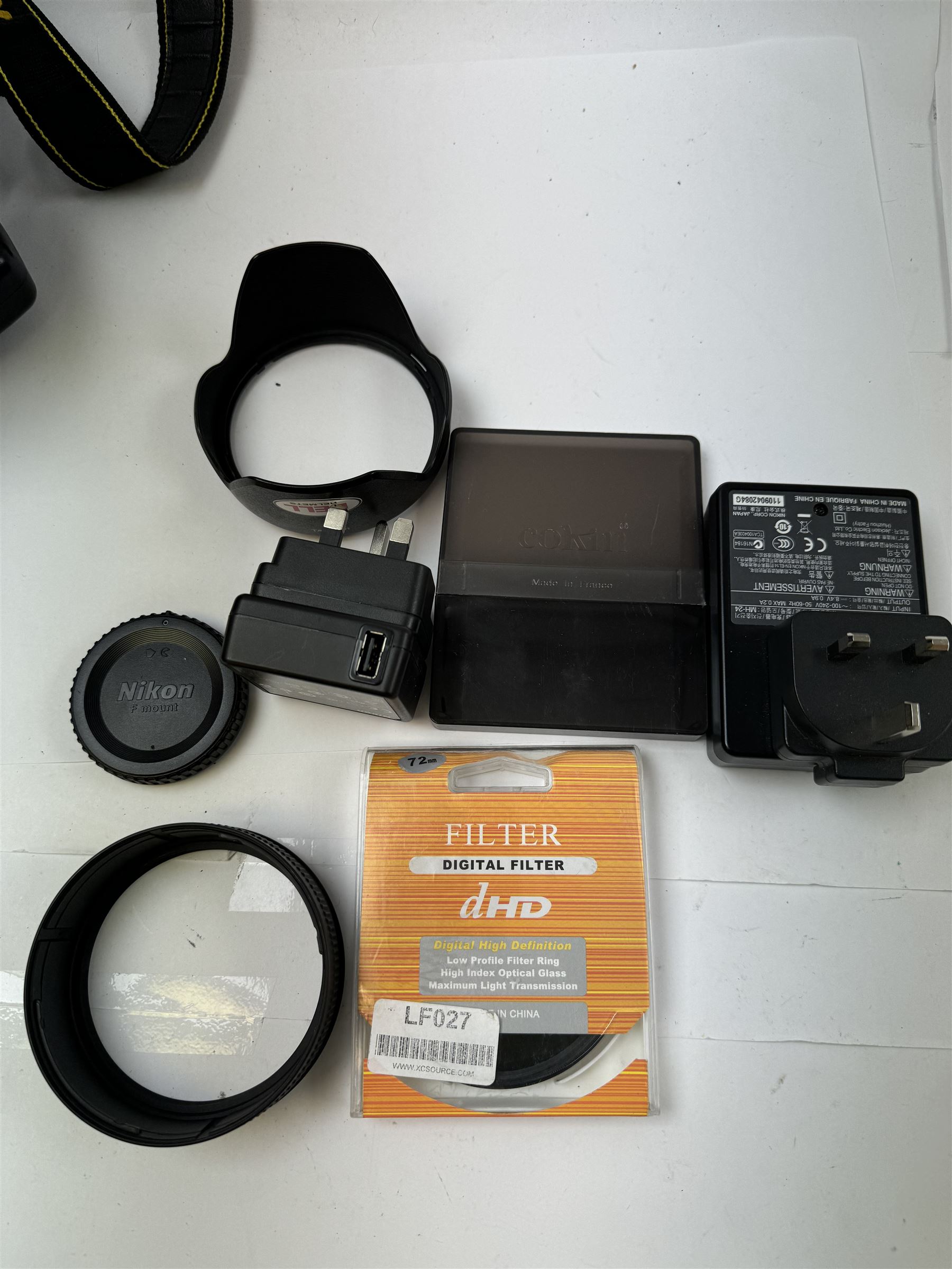 Nikon D5100 SLR camera body serial no. 6353702, together with three lenses, to include Tamron 18-270mm 1:3.5-6.3 serial no. 062941,  serial no. 50524365, Nikon AF-S DX Nikkor 18-55mm 1:3.5-5.6GII serial no. 2396396 and a collection of associated accessories, including battery grip, three large tripods, flashes, filters, Caden carry case, etc 