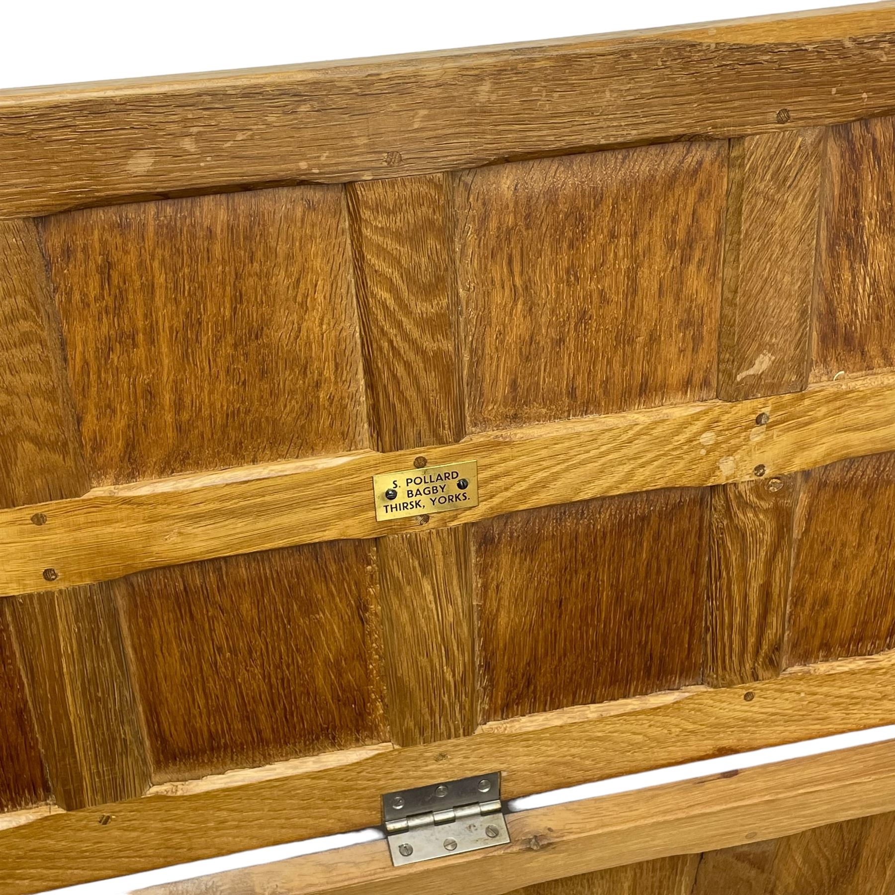 Sid Pollard (ex. Mouseman) - Yorkshire oak blanket chest, all over panelling, enclosed by hinged lid, on octagonal feet, interior plaque inscribed 'S. Pollard, Bagby, Thirsk, Yorks' 