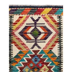 Chobi Kilim rug, pale ground and decorated with multi-coloured geometric pattern 